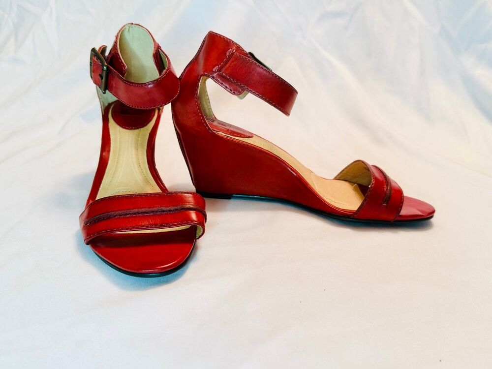 Red leather Frye buckle wedge sandals. Size 7.5M. Carol Seam.